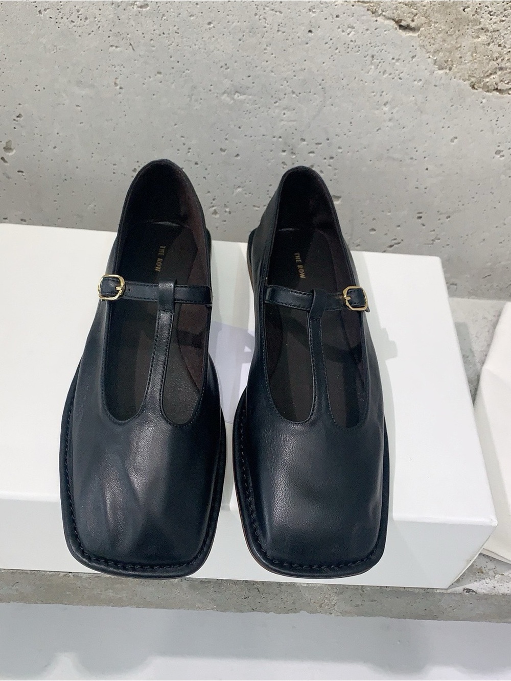 The Row Black Leather T-Strap Square-Toe Flats with Gold Buckle